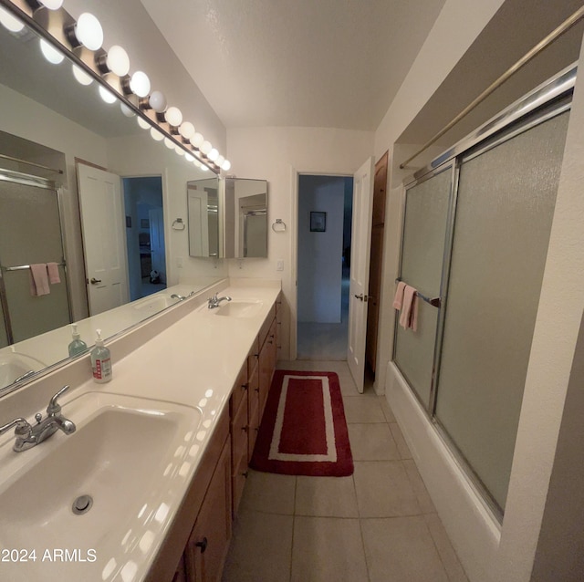 bathroom with vanity, enclosed tub / shower combo, and tile patterned floors