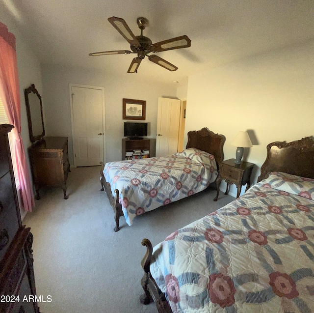 bedroom featuring ceiling fan and carpet flooring