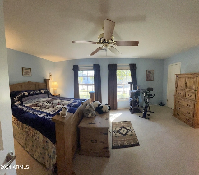 bedroom with light carpet and ceiling fan