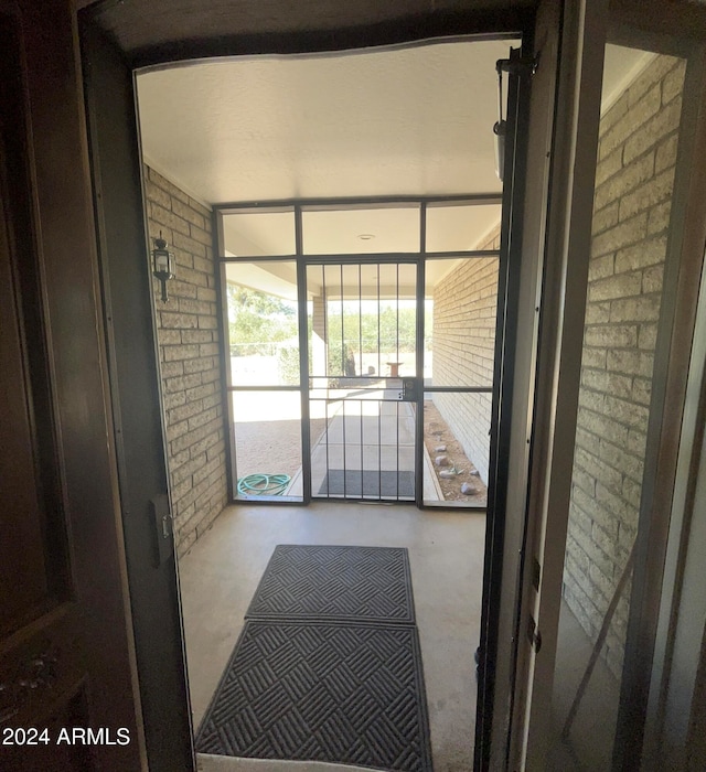 doorway with brick wall