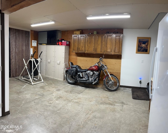 basement with white fridge