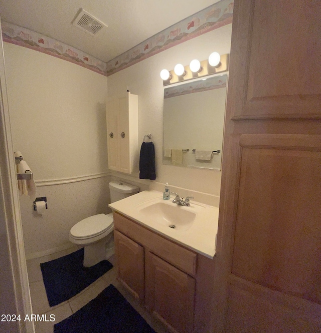 bathroom featuring toilet and vanity