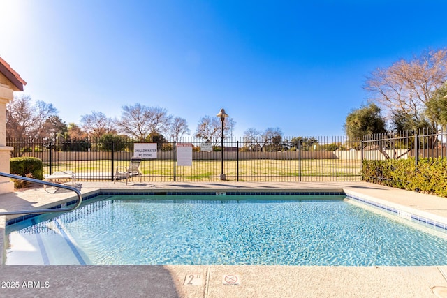 community pool featuring fence