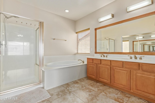 bathroom with shower with separate bathtub and vanity