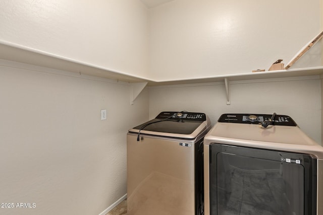 clothes washing area featuring washing machine and dryer and carpet