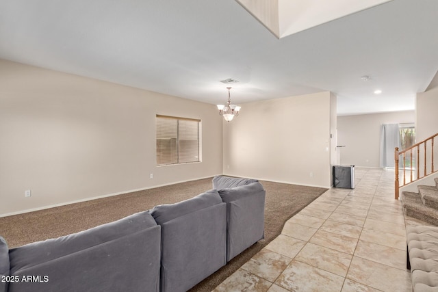 living room featuring light tile patterned floors and an inviting chandelier