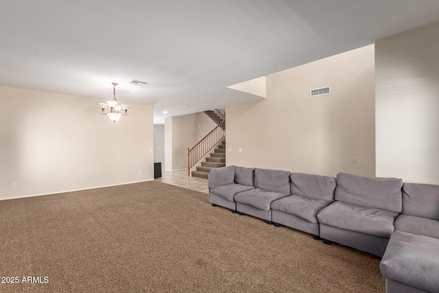 carpeted living room with an inviting chandelier