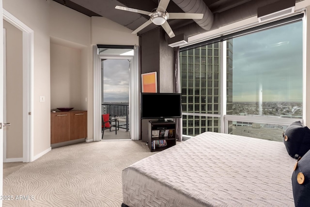 carpeted bedroom featuring multiple windows