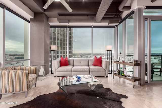 living room featuring a wall of windows