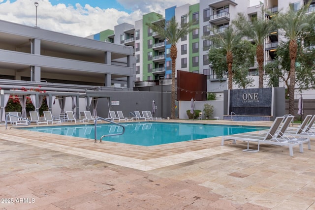 view of swimming pool with a patio area