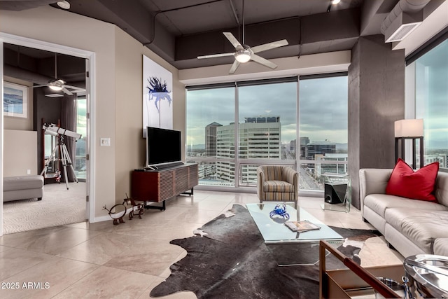 tiled living room with ceiling fan and a wealth of natural light