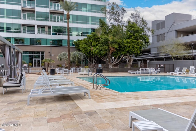 view of swimming pool with a patio area