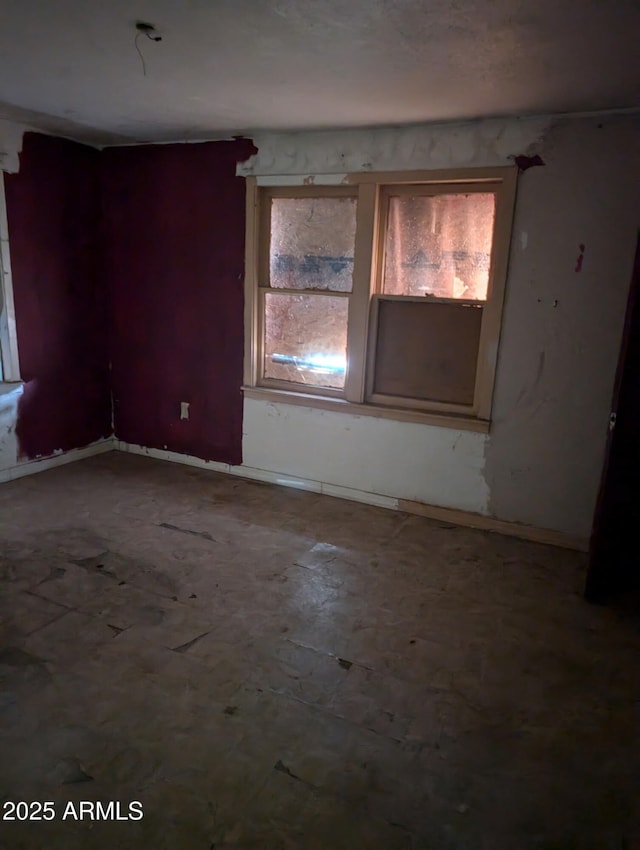 504 W Baseline Rd, Buckeye, AZ 85326 - spare room with baseboards and a healthy amount of sunlight