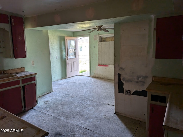 504 W Baseline Rd, Buckeye, AZ 85326 - kitchen featuring a sink, ceiling fan, and light carpet
