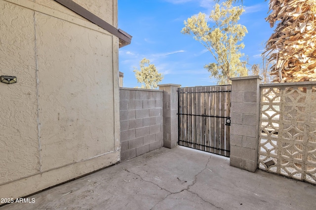 view of gate with fence