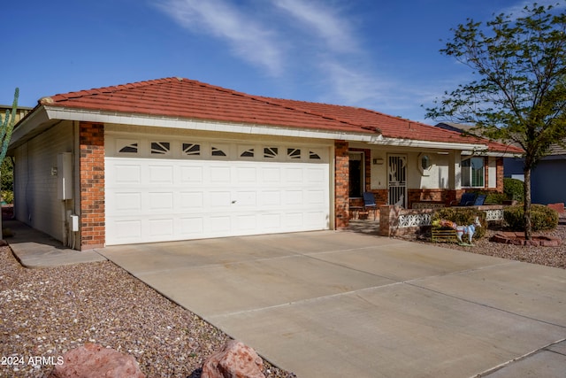 view of front of property with a garage and covered porch