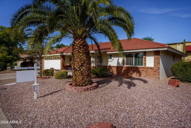 single story home featuring a garage