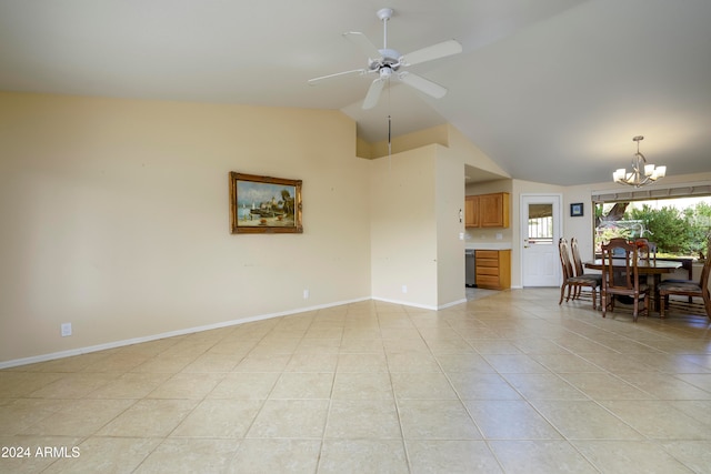 unfurnished living room featuring ceiling fan with notable chandelier, light tile patterned floors, and vaulted ceiling