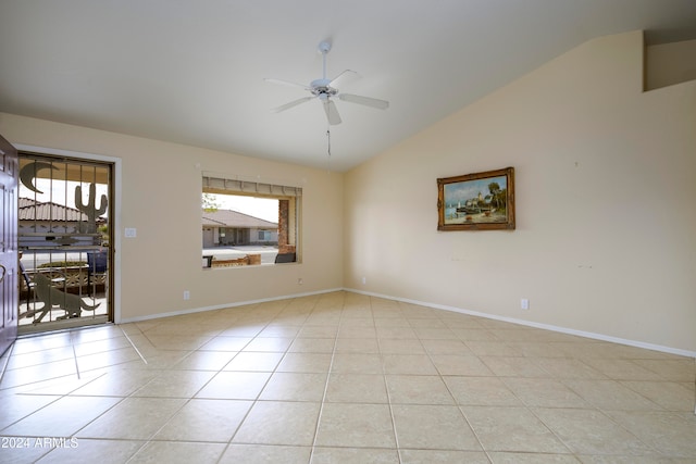 unfurnished room featuring plenty of natural light, lofted ceiling, light tile patterned floors, and ceiling fan