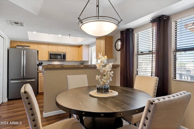 dining space with dark wood-type flooring