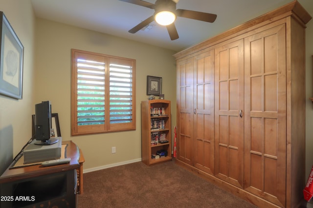carpeted home office featuring ceiling fan and baseboards