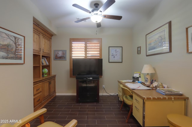 office featuring baseboards and ceiling fan