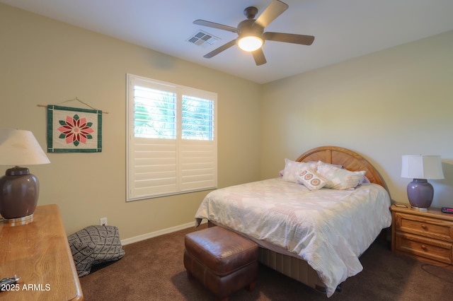 carpeted bedroom featuring baseboards, a ceiling fan, and visible vents