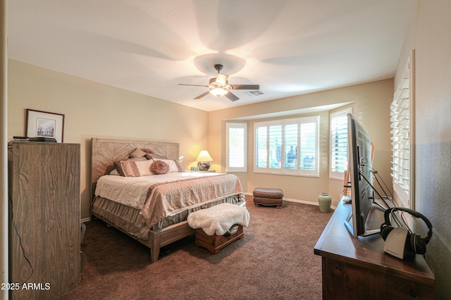 carpeted bedroom featuring visible vents, baseboards, and ceiling fan