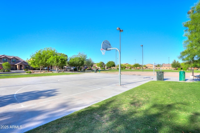 view of basketball court featuring community basketball court and a yard