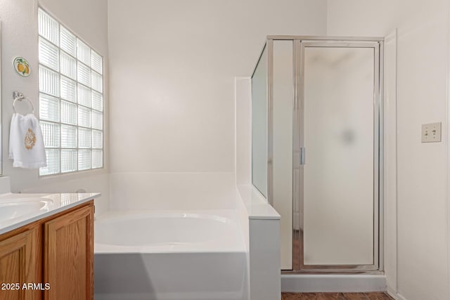 bathroom with vanity and plus walk in shower