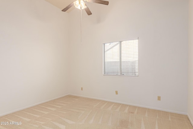 unfurnished room featuring light colored carpet and ceiling fan