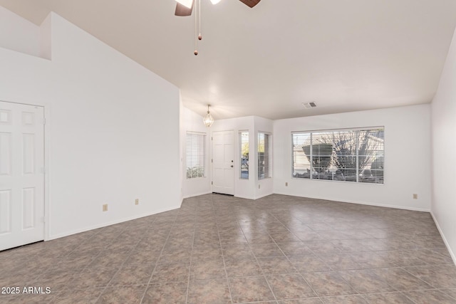 unfurnished living room featuring ceiling fan, tile patterned floors, and high vaulted ceiling