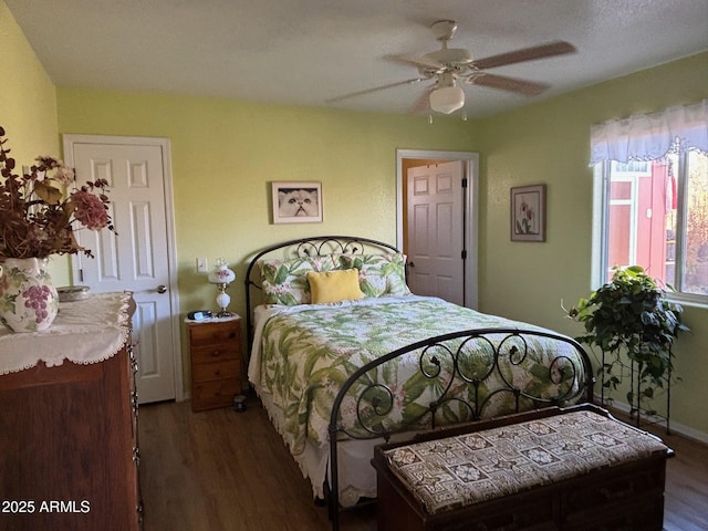 bedroom with a ceiling fan and wood finished floors