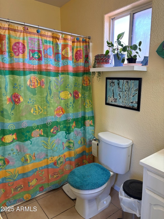 full bath with vanity, a shower with curtain, tile patterned flooring, toilet, and a textured wall