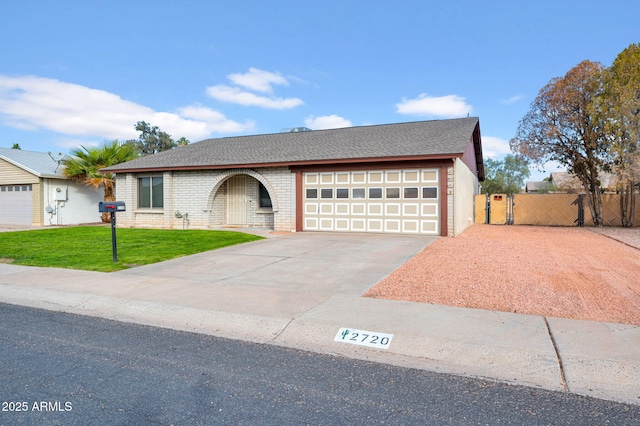 ranch-style house with a front lawn and a garage