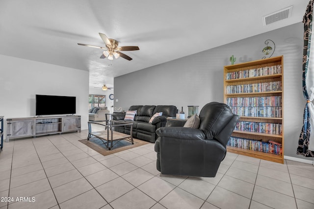 tiled living room featuring ceiling fan