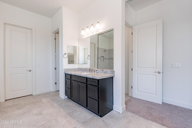 bathroom with vanity and walk in shower