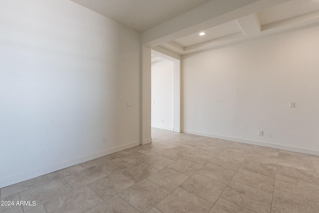 unfurnished room featuring light tile patterned floors