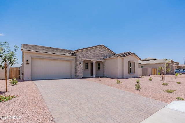 single story home featuring a garage