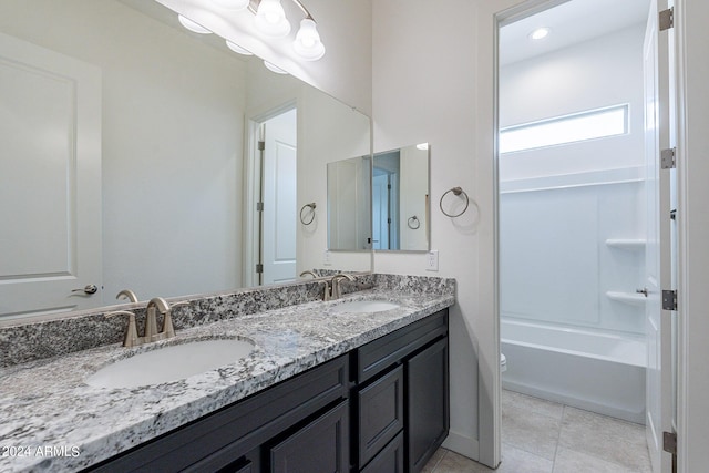 full bathroom with tile patterned floors, vanity, tub / shower combination, and toilet