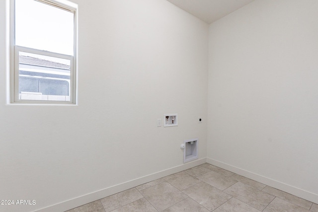 clothes washing area with hookup for an electric dryer and hookup for a washing machine