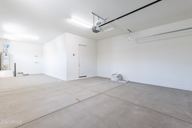 garage with a garage door opener and water heater