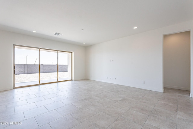 unfurnished room featuring light tile patterned floors