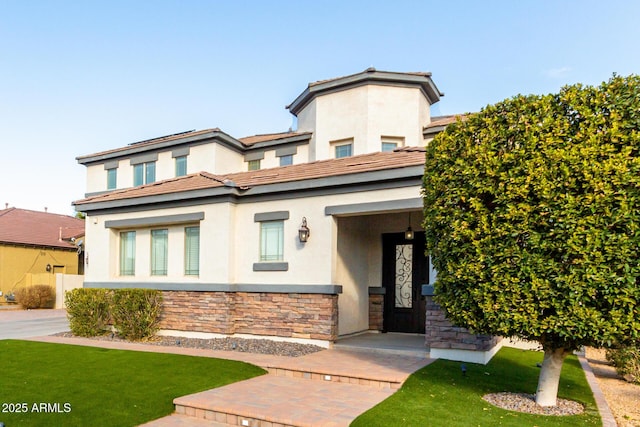 view of front of house featuring a front lawn