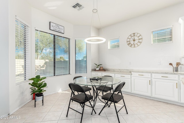 dining room with light tile patterned flooring