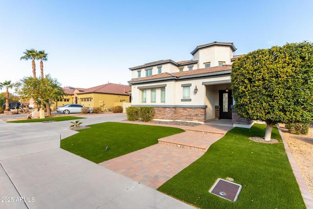 view of front of home featuring a front yard