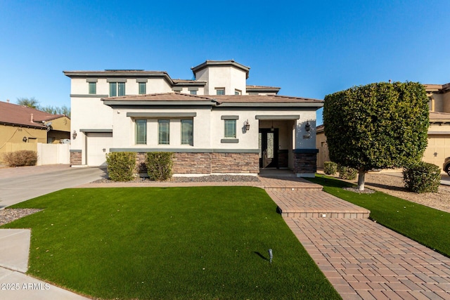 prairie-style home with a garage and a front yard