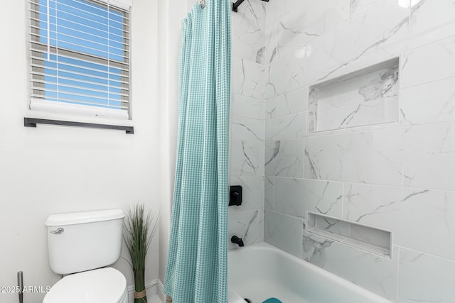 bathroom featuring shower / bathtub combination with curtain and toilet