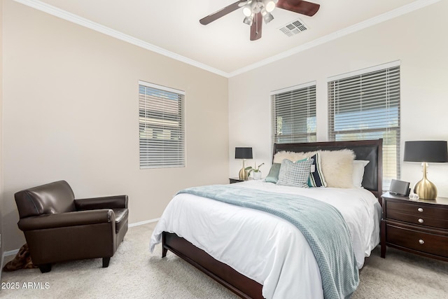 carpeted bedroom featuring ornamental molding and ceiling fan