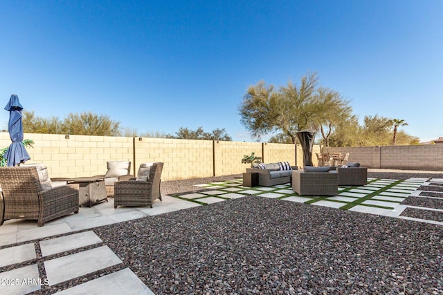 view of yard with outdoor lounge area and a patio area